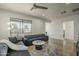 Bright living room features a large window, modern ceiling fan and stylish decor at 2719 N Greenfield Rd, Phoenix, AZ 85006