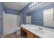 Well-lit bathroom features vanity with sink, a tiled shower-tub and stylish accents at 3023 W Quail Ave, Phoenix, AZ 85027