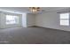 Expansive bedroom with carpet, multiple windows and neutral paint offers versatility at 3023 W Quail Ave, Phoenix, AZ 85027