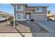 Charming two-story home with a well-manicured front yard and a two-car garage at 3023 W Quail Ave, Phoenix, AZ 85027