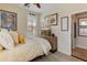 A comfortably appointed bedroom featuring a dresser with a TV, complemented by tasteful wall art at 31061 N 136Th Ln, Peoria, AZ 85383