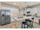 Modern kitchen featuring stainless steel appliances, granite countertops, a center island, and ample cabinet space at 31061 N 136Th Ln, Peoria, AZ 85383