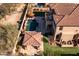 Expansive backyard with a refreshing pool, cabana, lush greenery, and a sport court at 31816 N 19Th Ave, Phoenix, AZ 85085