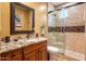 Beautiful bathroom with granite countertops, a glass shower, and modern fixtures, offering a spa-like experience at 31816 N 19Th Ave, Phoenix, AZ 85085