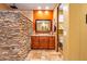 Contemporary bathroom featuring a walk-in shower, stone wall, and updated vanity at 31816 N 19Th Ave, Phoenix, AZ 85085