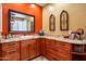 Spacious bathroom vanity with dual sinks, granite countertops, and decorative wall art at 31816 N 19Th Ave, Phoenix, AZ 85085