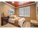 Bedroom featuring plush carpet, an accent wall, and natural light from the windows at 31816 N 19Th Ave, Phoenix, AZ 85085