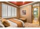 Bedroom featuring plush carpet, an accent wall, and natural light from the windows at 31816 N 19Th Ave, Phoenix, AZ 85085