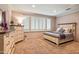 Bedroom featuring plush carpet, an dresser, and natural light from the windows at 31816 N 19Th Ave, Phoenix, AZ 85085