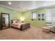 Bedroom with plush carpet, an accent wall and ample natural light from the windows at 31816 N 19Th Ave, Phoenix, AZ 85085