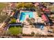 Aerial view of community pool and recreation center with pool, playground and lawns at 31816 N 19Th Ave, Phoenix, AZ 85085