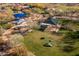 Aerial view of community dog park with play structures and grassy area at 31816 N 19Th Ave, Phoenix, AZ 85085