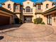 Two story home with a circular driveway and landscaped front yard at 31816 N 19Th Ave, Phoenix, AZ 85085