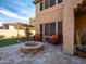 Inviting outdoor fire pit with comfortable seating, perfect for entertaining in a cozy backyard setting at 31816 N 19Th Ave, Phoenix, AZ 85085