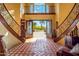 Foyer with decorative tile, winding staircase, and light filled entry to the backyard at 31816 N 19Th Ave, Phoenix, AZ 85085