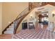 Inviting foyer with custom staircase and tile design, leading to dining room at 31816 N 19Th Ave, Phoenix, AZ 85085