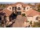 Grand home exterior featuring mature landscaping and a circular driveway at 31816 N 19Th Ave, Phoenix, AZ 85085