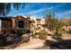 Home exterior featuring well-maintained landscaping and mature desert plants at 31816 N 19Th Ave, Phoenix, AZ 85085