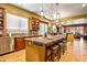 Spacious kitchen with island, granite countertops, and stainless steel appliances overlooking a seating area at 31816 N 19Th Ave, Phoenix, AZ 85085