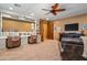 Comfortable living room with a ceiling fan, built in shelving, and dual desks at 31816 N 19Th Ave, Phoenix, AZ 85085