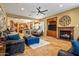 Open-concept living area with fireplace, media center, and seamless flow to the kitchen at 31816 N 19Th Ave, Phoenix, AZ 85085