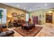 Comfortable living room features tile floors, plantation shutters, plush seating, and ample natural light, creating a cozy atmosphere at 31816 N 19Th Ave, Phoenix, AZ 85085