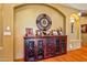 Living room featuring a rustic wood cabinet, decor, and neutral paint at 31816 N 19Th Ave, Phoenix, AZ 85085