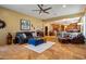 Comfortable living room featuring tile flooring, a ceiling fan, and an open floor plan at 31816 N 19Th Ave, Phoenix, AZ 85085