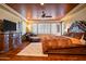 Luxurious main bedroom with hardwood floors, plantation shutters, and a decorative ceiling at 31816 N 19Th Ave, Phoenix, AZ 85085