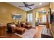 Relaxing sitting room showcasing hardwood floors, comfortable seating, and stylish decor, creating a cozy and inviting atmosphere at 31816 N 19Th Ave, Phoenix, AZ 85085