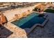 Beautiful pool with multiple cascading waterfalls, lush landscaping, and outdoor dining at 31816 N 19Th Ave, Phoenix, AZ 85085