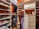 Organized walk-in closet with built-in shelving and hanging rods providing ample storage space at 31816 N 19Th Ave, Phoenix, AZ 85085