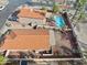 Aerial view of the property showing pool, desert landscaping and the red tile roof at 3311 W Baylor Ln, Chandler, AZ 85226