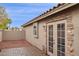 This backyard features a brick patio and is surrounded by neutral walls at 3311 W Baylor Ln, Chandler, AZ 85226