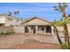 Backyard featuring a brick patio with curtains and a small lawn area at 3311 W Baylor Ln, Chandler, AZ 85226