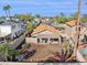 Aerial view of a backyard featuring a covered patio, desert landscaping, and block fencing at 3311 W Baylor Ln, Chandler, AZ 85226