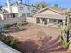 A partially-shaded backyard with a covered patio and desert landscaping, set behind a block fence at 3311 W Baylor Ln, Chandler, AZ 85226