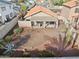 Aerial view of the backyard featuring a covered patio, brickwork, and a spacious area ready for landscaping at 3311 W Baylor Ln, Chandler, AZ 85226