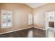 Bedroom boasts wood floors, tan walls, and two windows with matching white wood shutters at 3311 W Baylor Ln, Chandler, AZ 85226