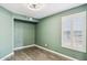 This bedroom features a ceiling fan, wood floors and a window with white shutters at 3311 W Baylor Ln, Chandler, AZ 85226