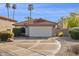 Charming single-level home featuring a tile roof, desert landscaping, and a two-car garage at 3311 W Baylor Ln, Chandler, AZ 85226