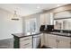 Bright kitchen features granite countertops, stainless steel dishwasher, and a kitchen island at 3311 W Baylor Ln, Chandler, AZ 85226