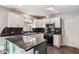 This kitchen features a stainless steel oven and microwave and striking granite countertops at 3311 W Baylor Ln, Chandler, AZ 85226