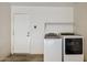 This laundry room features modern washer and dryer with shelf at 3311 W Baylor Ln, Chandler, AZ 85226