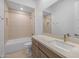 Bathroom featuring a tiled shower and bath, a vanity with a large mirror, and neutral-colored fixtures at 34283 N Sandpiper Trl, Queen Creek, AZ 85144