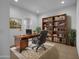 Home office featuring a desk, bookcase, and a window for natural light at 34283 N Sandpiper Trl, Queen Creek, AZ 85144