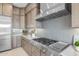 Modern kitchen featuring professional-grade gas range, and ample counter space with modern backsplash at 34283 N Sandpiper Trl, Queen Creek, AZ 85144