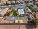 Aerial view of community recreation including pool, tennis courts and desert landscaping at 3864 W Fairway Dr, Eloy, AZ 85131