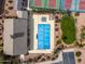 Aerial view of community amenities, including the pool, tennis courts, and recreation center at 3864 W Fairway Dr, Eloy, AZ 85131