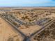 Aerial view of a neighborhood set against a desert landscape, showcasing the community layout at 3864 W Fairway Dr, Eloy, AZ 85131